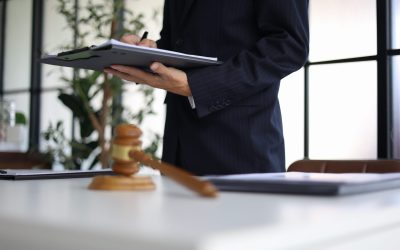 Legal counsel reading contract paperwork to finalize a legal agreement. Concepts for legal counsel, judicial authority, and the finality of a decision or agreement. 